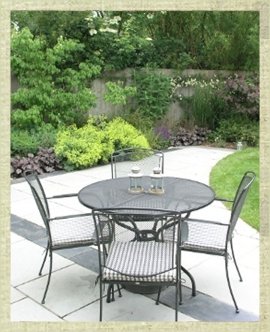 Paved patio area with table and chairs