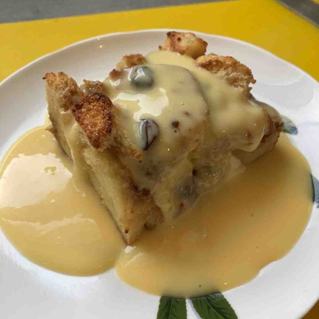 Apple pudding and custard served on a plate